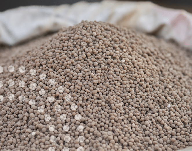 Pile of granular fertilizers in an open bag.