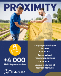 A field rep and customer standing in field inspecting a plant.